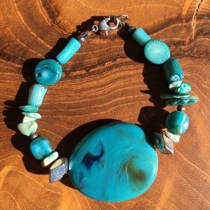 Turquoise pebble bracelet with a variety of smaller stones, single strand.